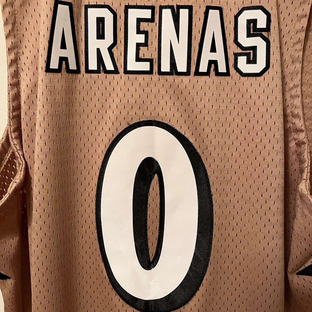 Gilbert Arenas gold alternate Adidas swing man jersey.